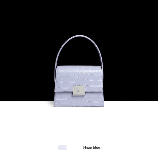 Haze blue handbag with a black and white background