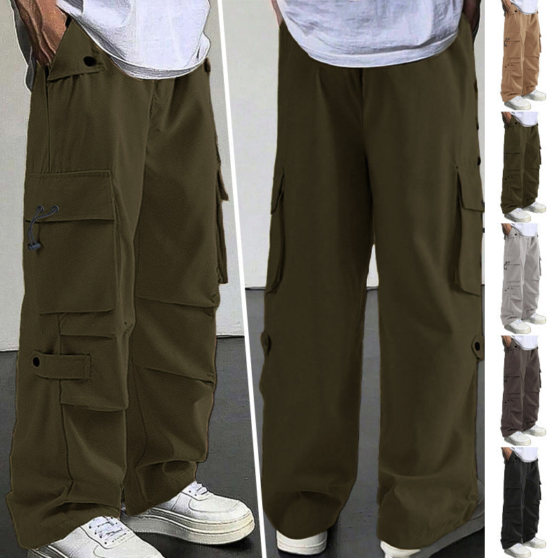 Olive green cargo pants worn by a person on a plain background