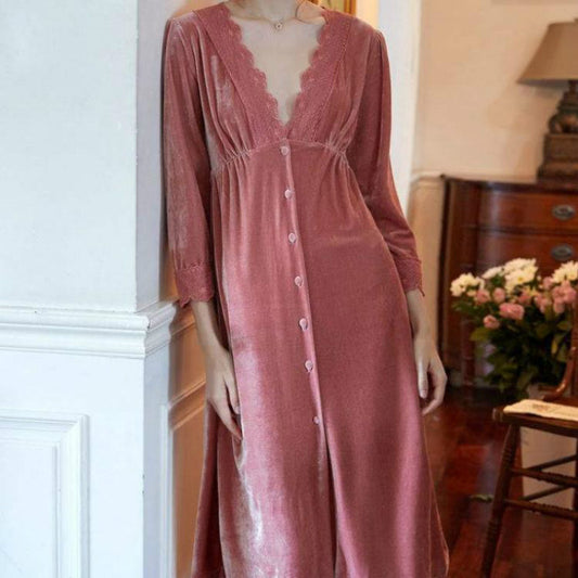 Pink velvet dress on a mannequin against a home interior background