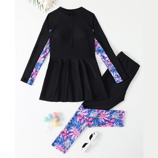 Black long-sleeve top and leggings with floral patterns on a white background