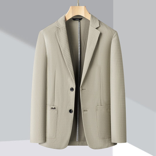 Beige checkered blazer on a wooden hanger against a light gray background