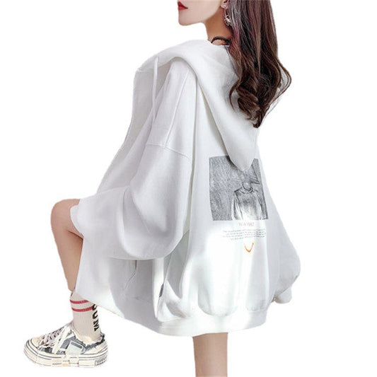 White oversized hoodie worn by a person on a white background