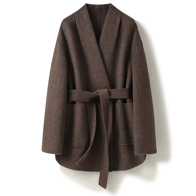 Brown coat with a belt on a white background