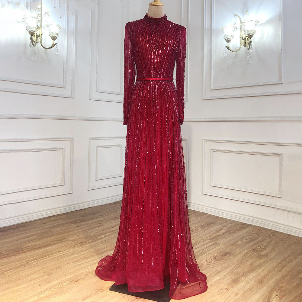 Red evening gown on a mannequin against a white wall.