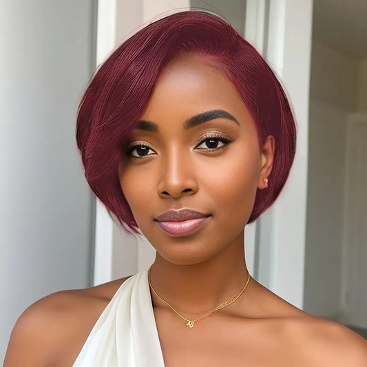 Woman with a stylish haircut and makeup against a neutral background