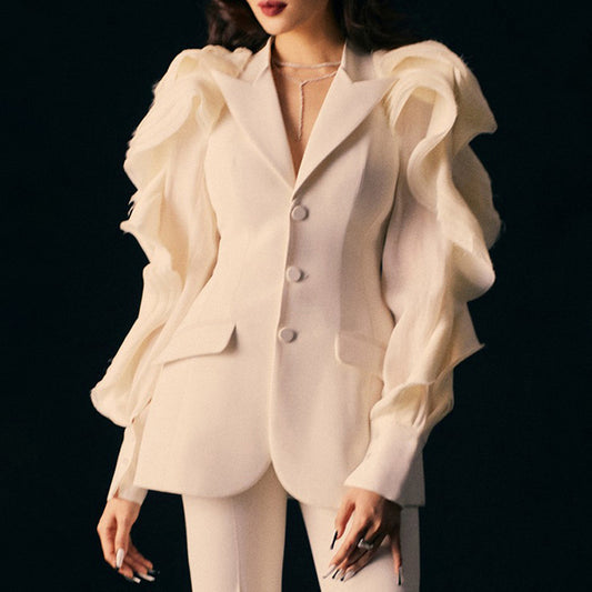 White ruffled blouse over a suit on a black background by millivan