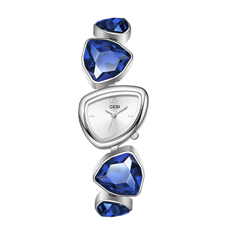 Watch with blue gemstones on a white background