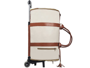 Beige rolling suitcase with brown leather straps on a white background